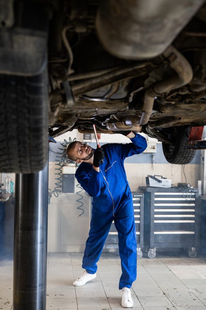 pexels-photo-8986104 Woman in Blue Coverall Fixing the Car